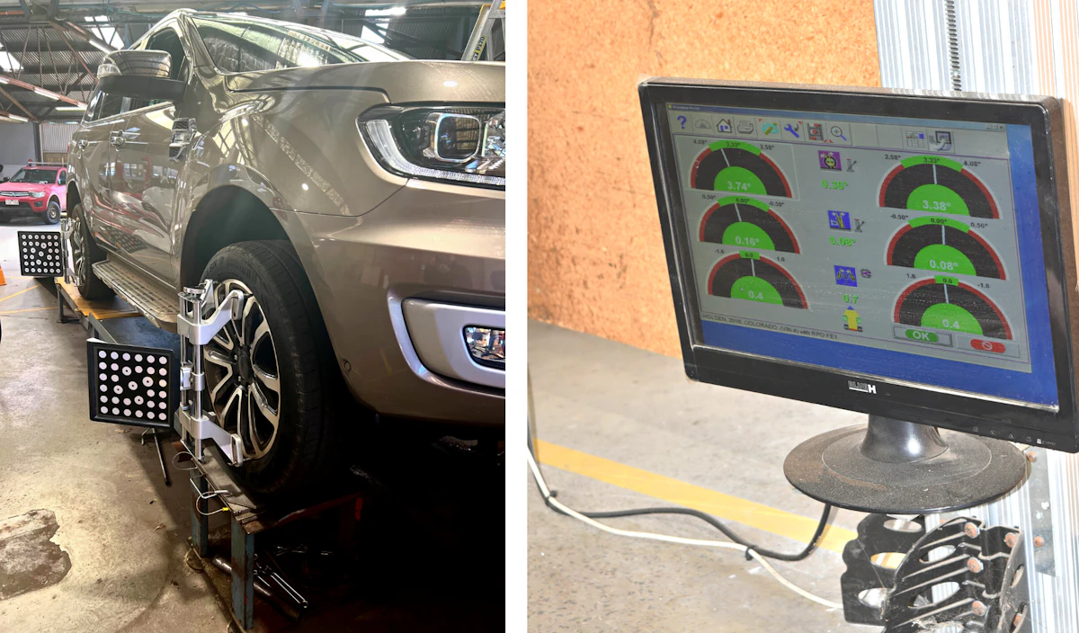 a vehicle undergoing as wheel alignment and digital report